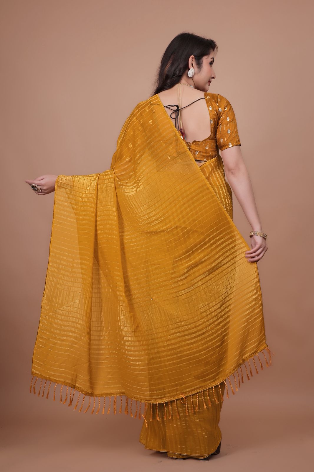 Hooriya Fashions - New premium georgette zari leheriya saree.