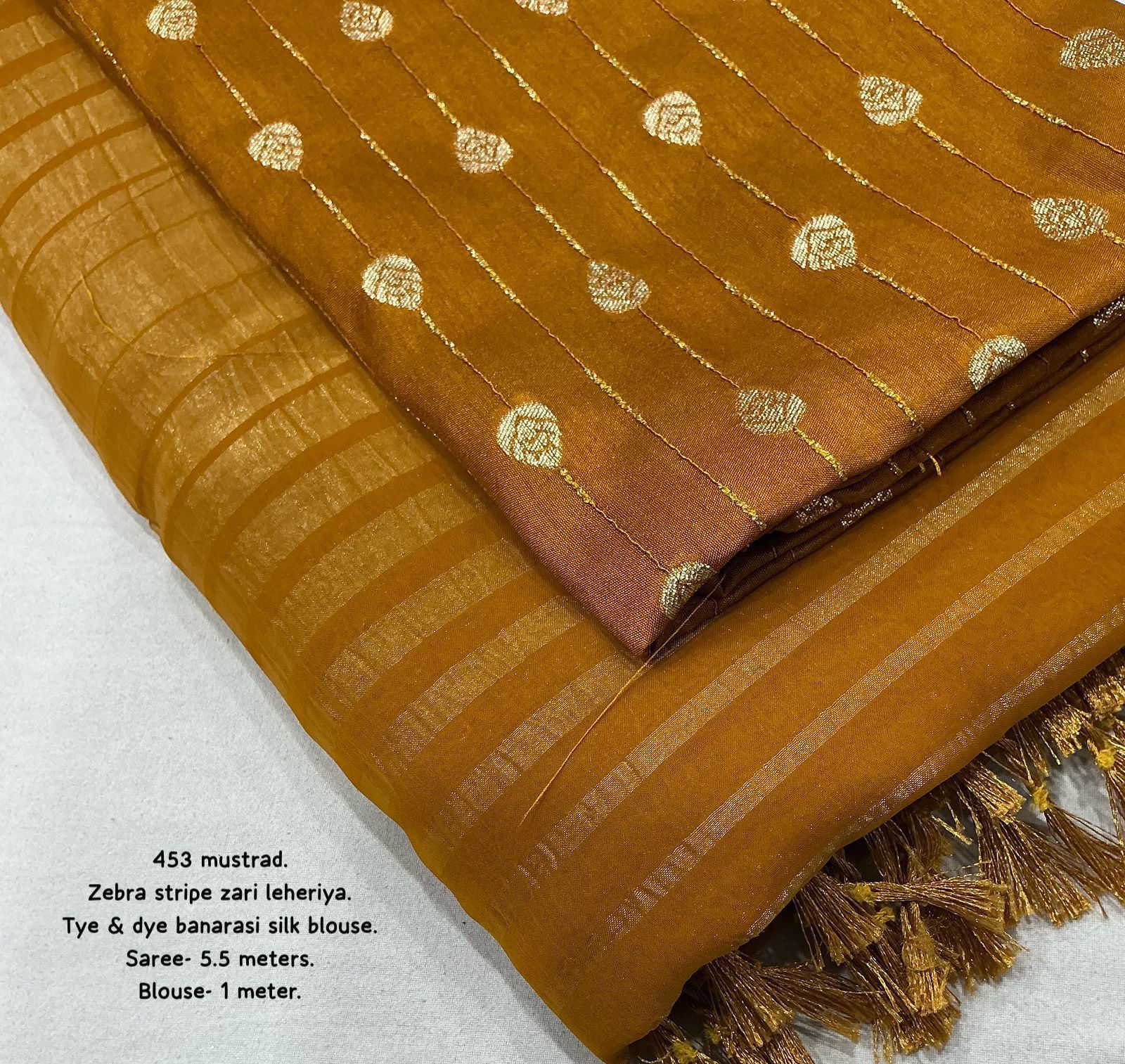 Hooriya Fashions - New premium georgette zari leheriya saree.