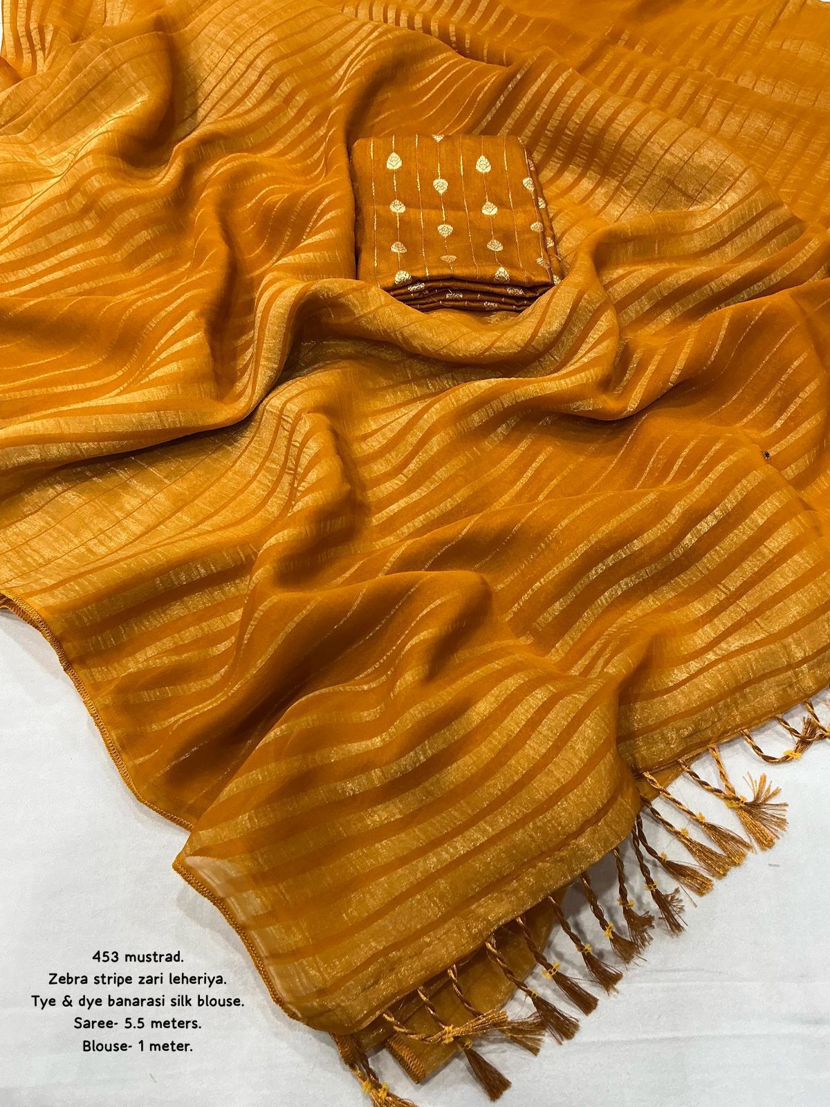 Hooriya Fashions - New premium georgette zari leheriya saree.