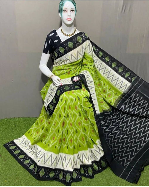 Green and black plain saree by Hooriya Fashions displayed on mannequin buy plain saree Hooriya