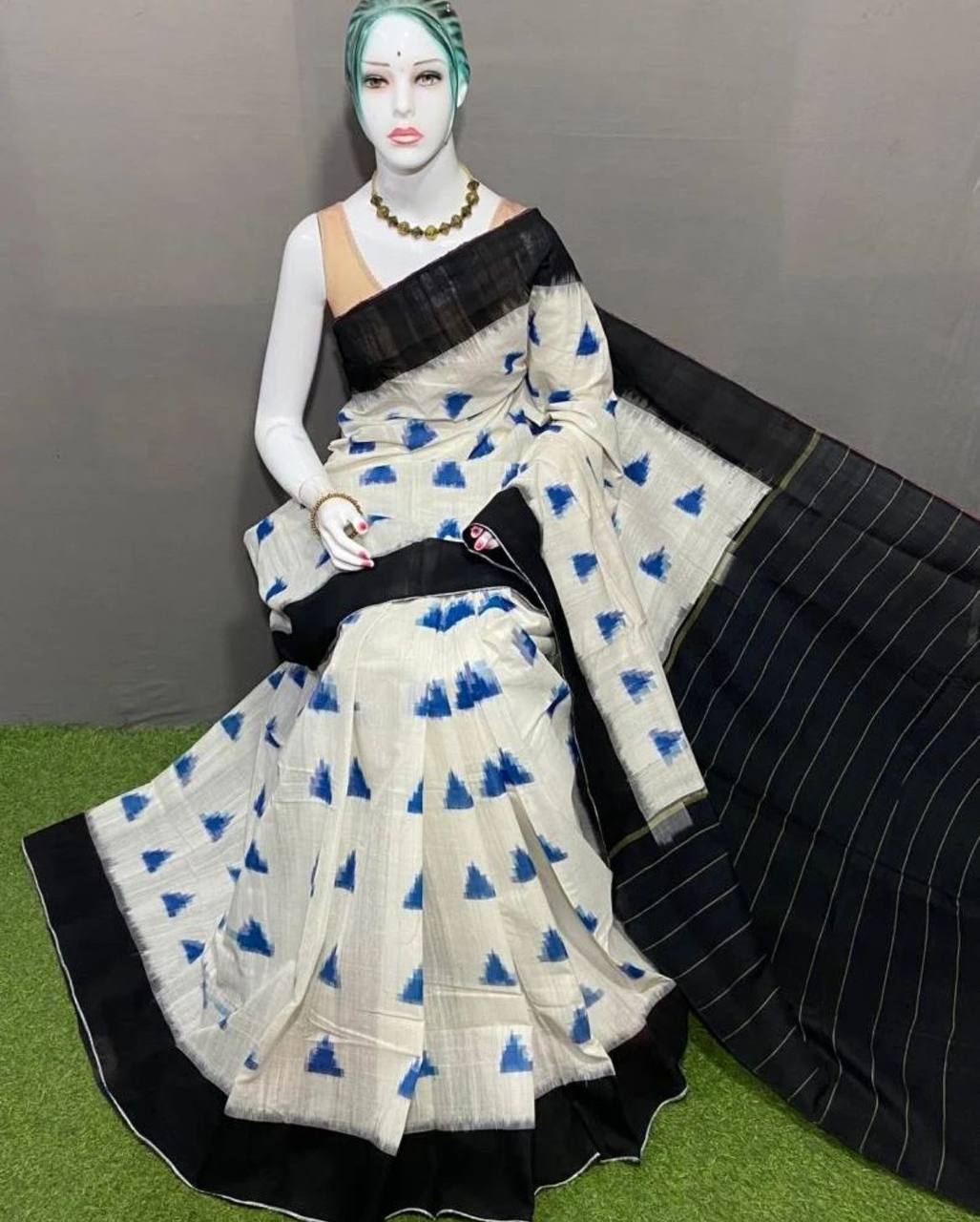 Hooriya premium saree white with blue triangle patterns and black border draped on mannequin